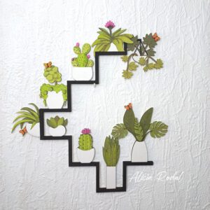 Mini jardín vertical de madera cortado con láser y pintado a mano con acuarelas. Una pieza que fusiona la precisión de la tecnología con la calidez del arte y mi pasión como artista.