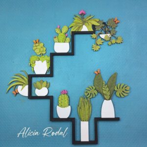 Mini jardín vertical de madera cortado con láser y pintado a mano con acuarelas. Una pieza que fusiona la precisión de la tecnología con la calidez del arte y mi pasión como artista.